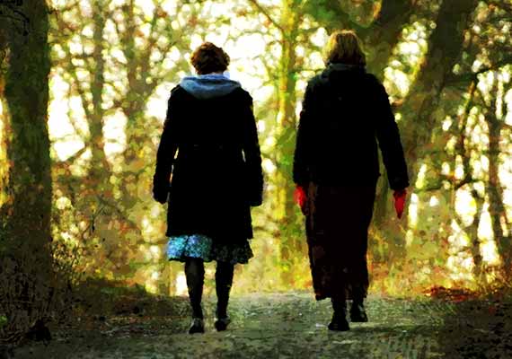 Painting of two women walking in the woods